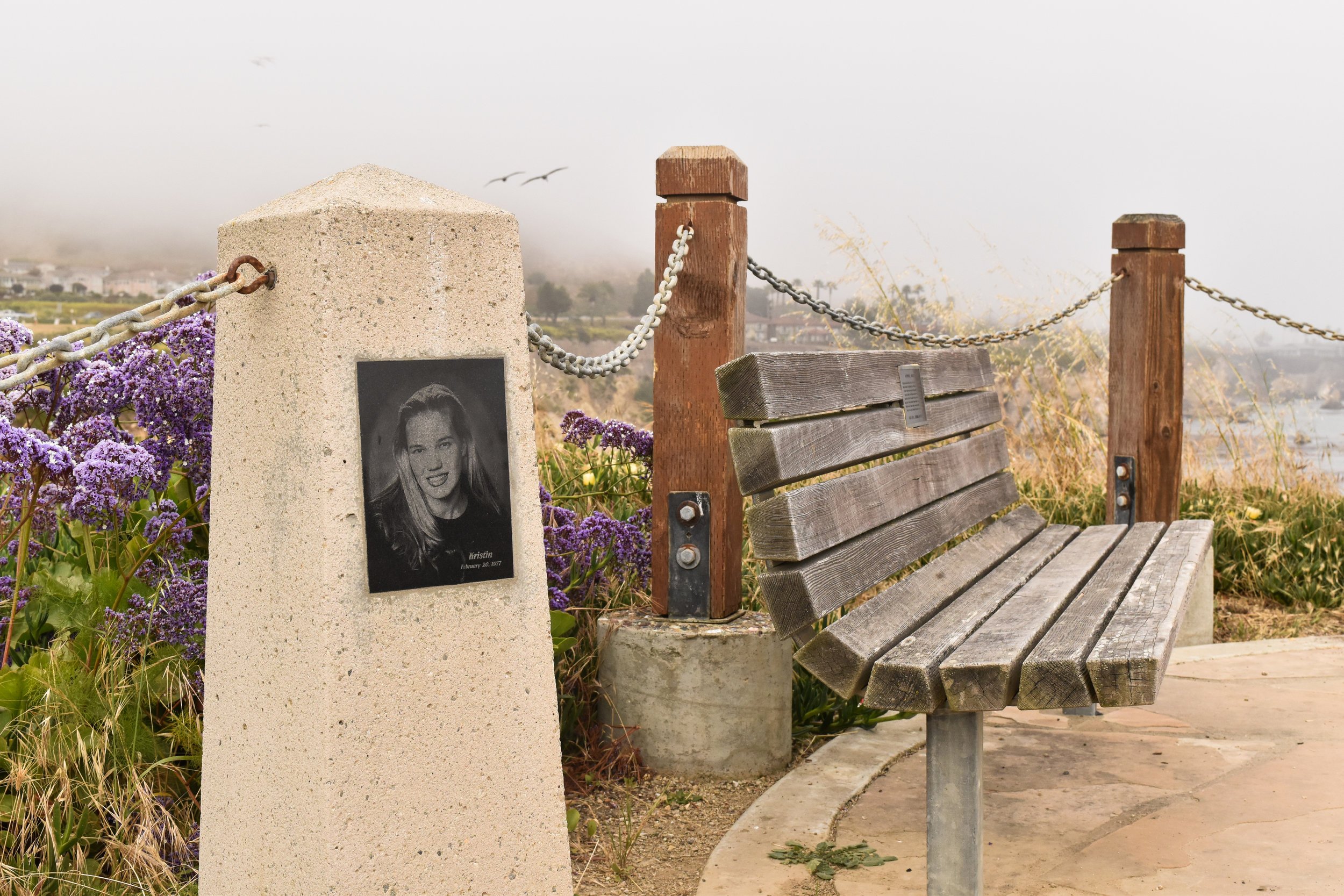 A memorial for Kristin Smart with flowers and candles