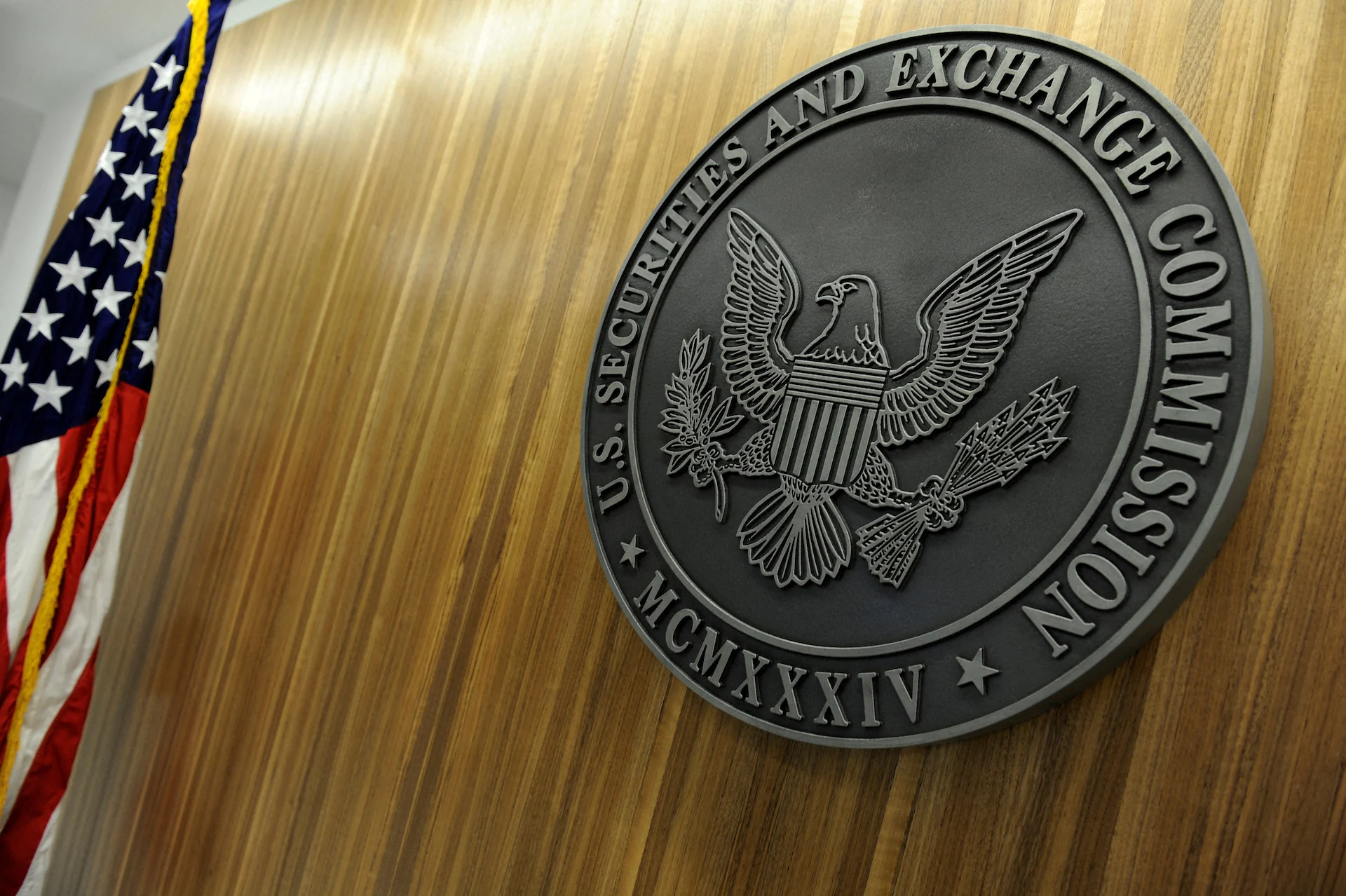 A view of the seal of the U.S. Securities and Exchange Commission mounted inside a federal building.