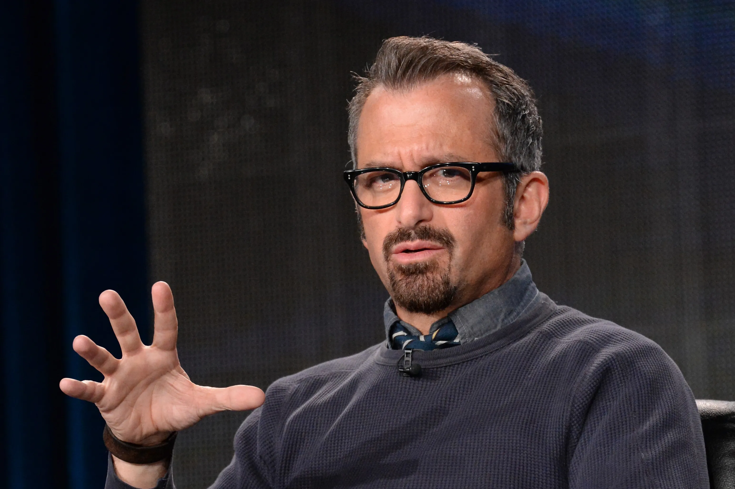 Andrew Jarecki speaking onstage during a Q and A