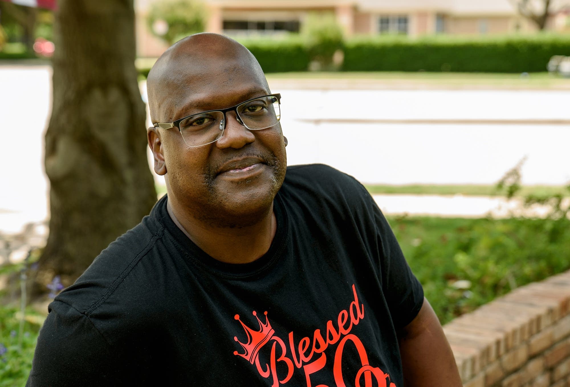Curtis Flowers outside a courthouse with supporters nearby