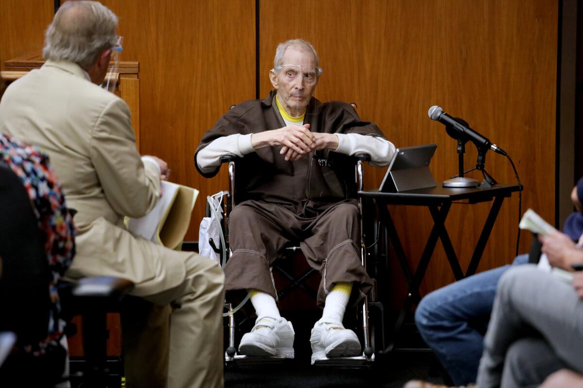 Robert Durst seated in a courtroom with court officials nearby
