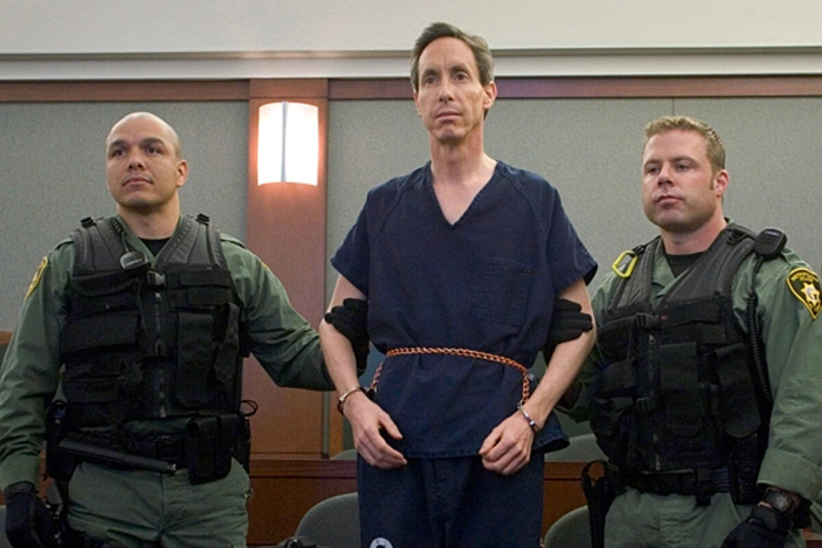 Warren Jeffs being escorted by law enforcement officers after his arrest